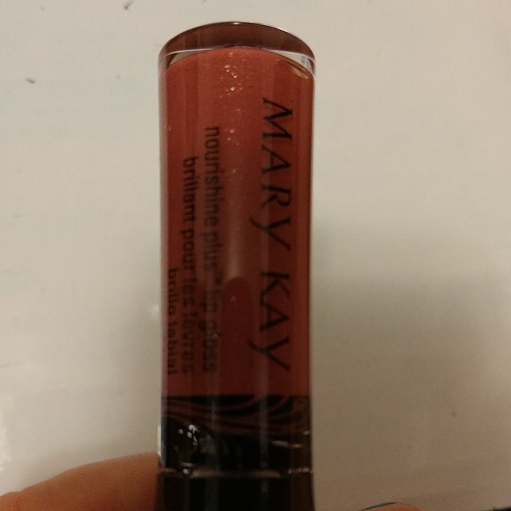 Pink luster nourishine plus lip gloss